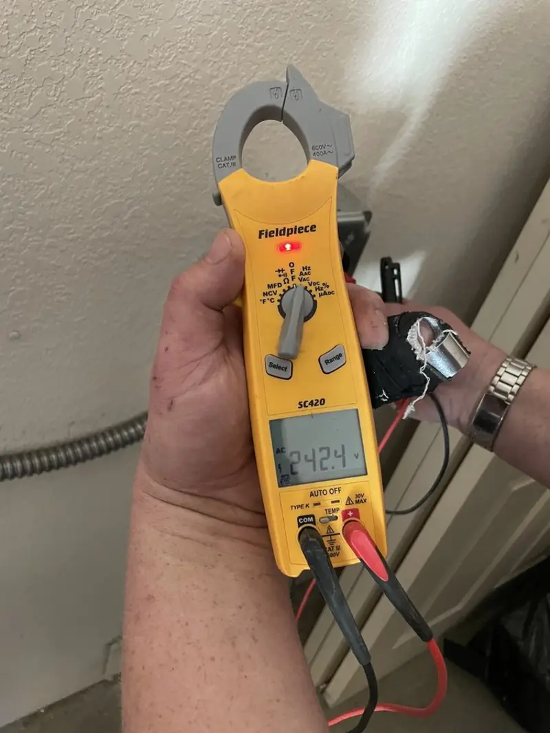 Voltage testing with clamp meter during Recessed Lighting Installation in Garner